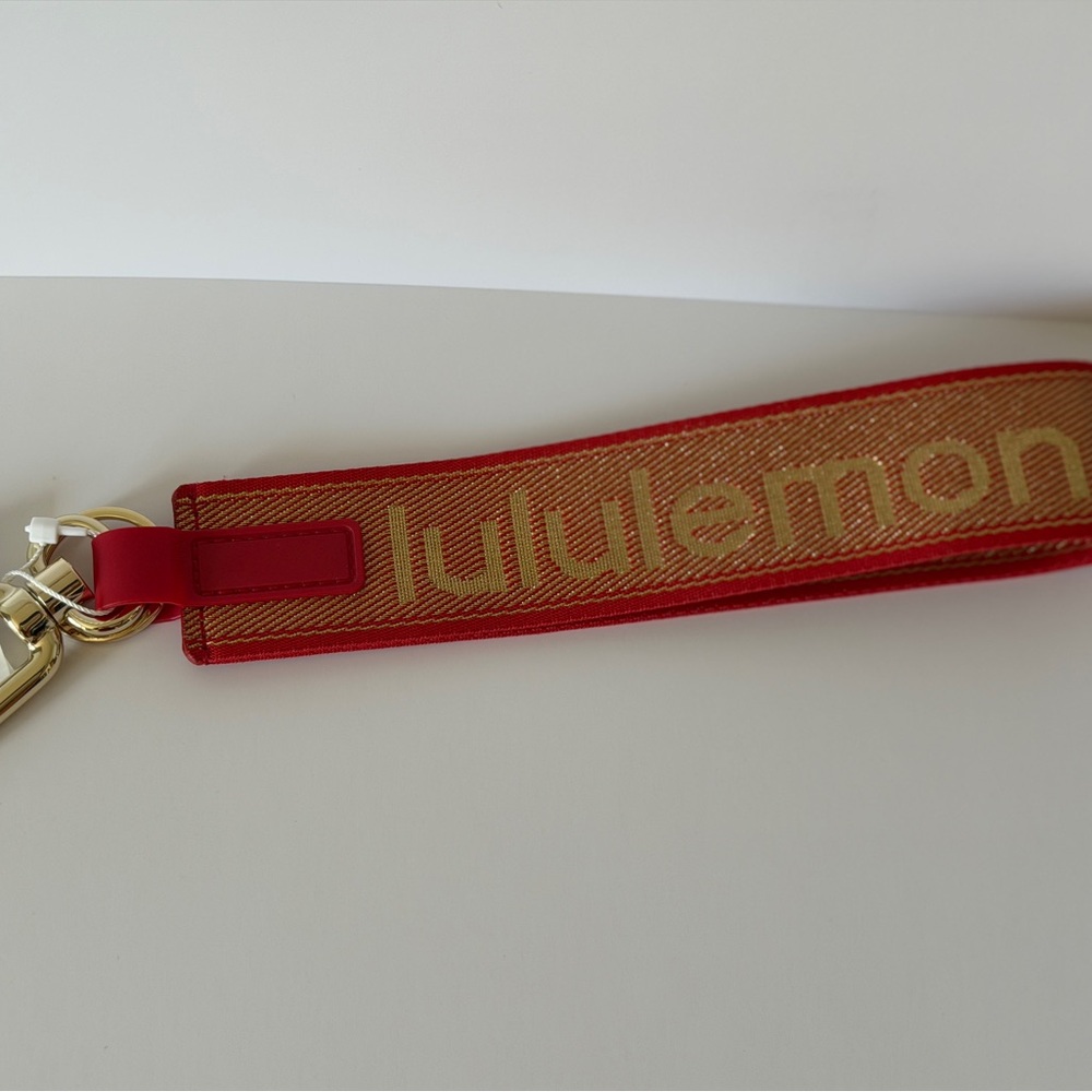 lululemon red and gold woven wristlet strap